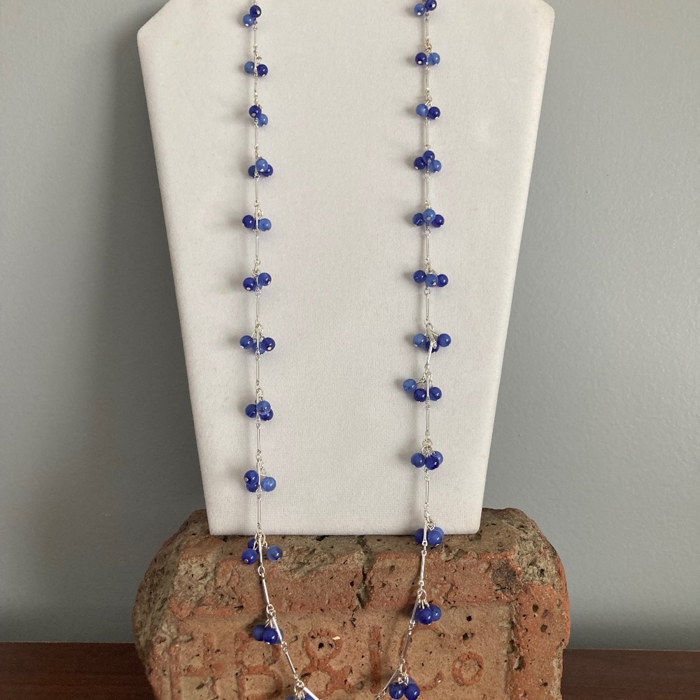 Chaps necklace in silver and blue.